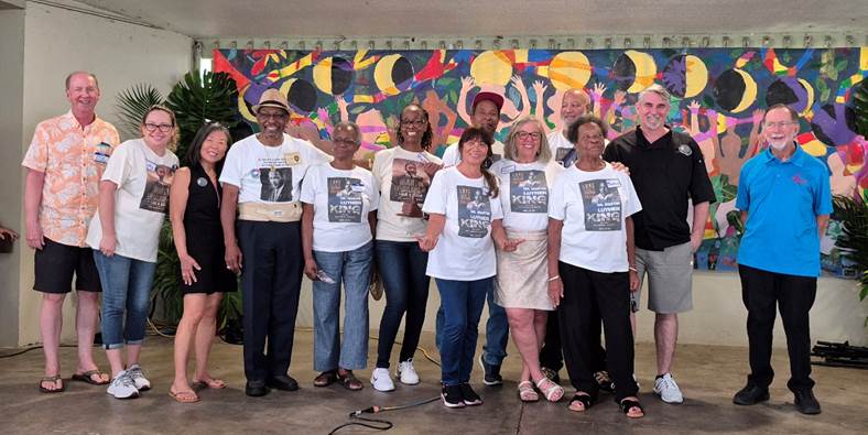 A group of people posing for a photo
Description automatically generated